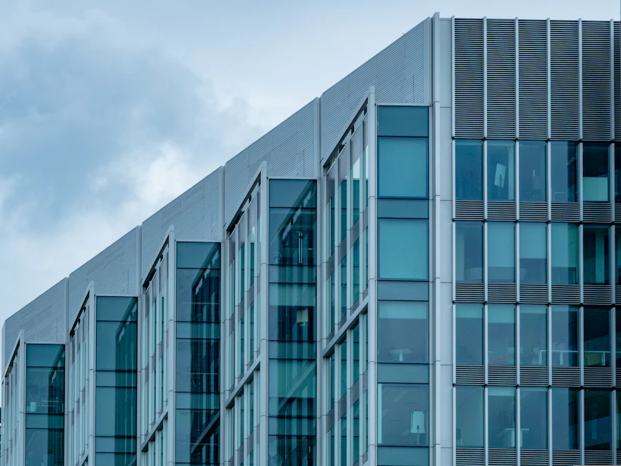 Modern office building with a blue glass and metal-fin facade